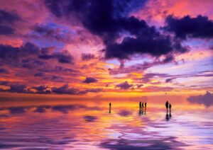 Silhouettes of people at sunrise